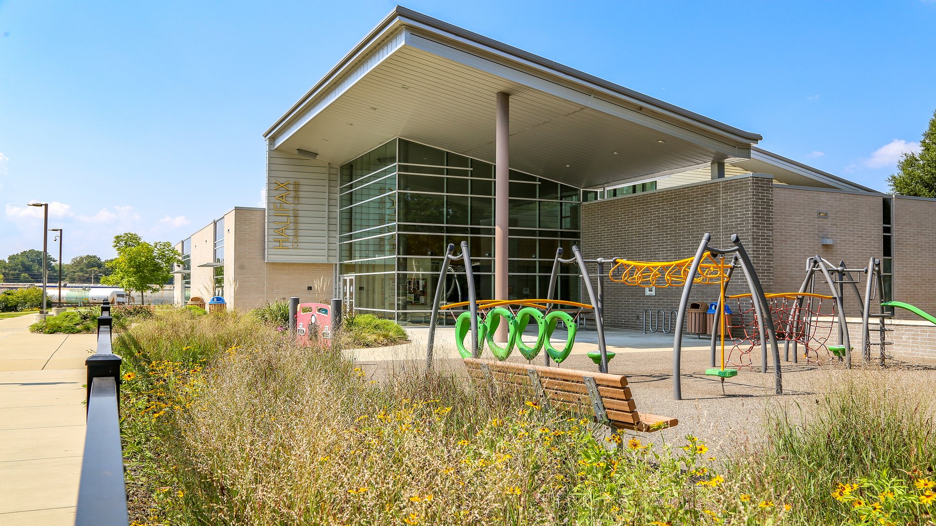 The outside of the Halifax Park community center and part of the playground 