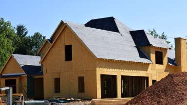Home being built on construction site.
