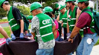 Emergency volunteers carrying supplies