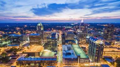 Aerial view of Raleigh skyline at dusk