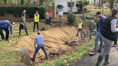 Stormwater staff repairing a stream bank