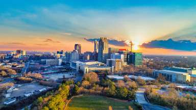 Raleigh's downtown skyline with fall trees visible