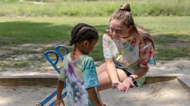 kid playing in sandbox