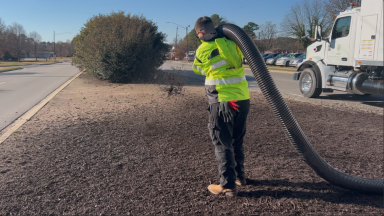 Mulch truck blower at work