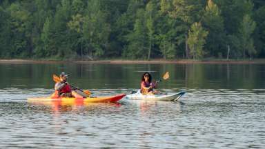two people on kayaks at Falls Lake