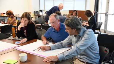 City planners looking at documents on table