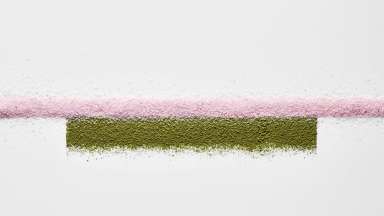 A horizontal pink powdered line stretches from side to side. A slightly thicker moss green powder rectangle is located just beneath the pink line.