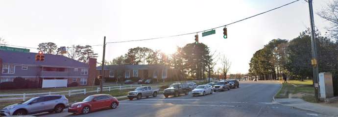 New Hope Road, between Capital Blvd and Wallingford Dr before sidewalk construction, shows foot path.