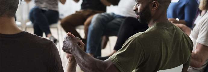 inclusive group sitting in a circle, having a conversation