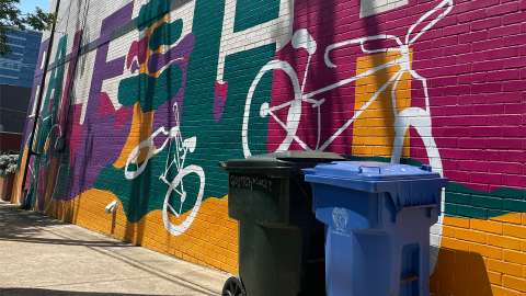 downtown_Raleighmural_with_garbage_and_recycling_cart