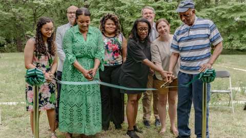 a dedication ribbon cutting with city employees