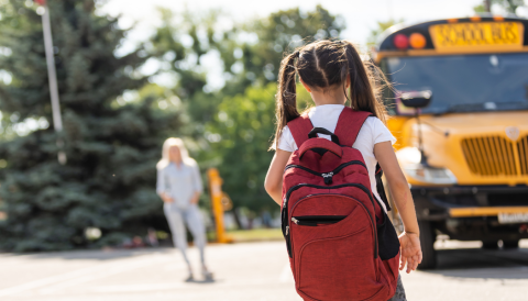 girl catching school bus