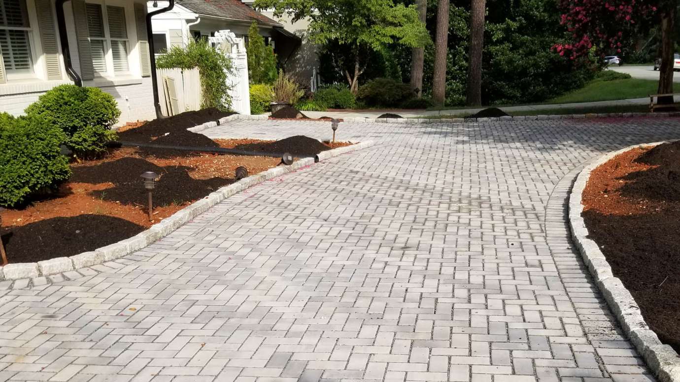 A driveway that made of blocks or washed stoned that allow water to soak into the ground. 