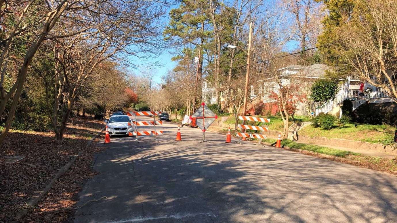 Road signs blocking off a closed street