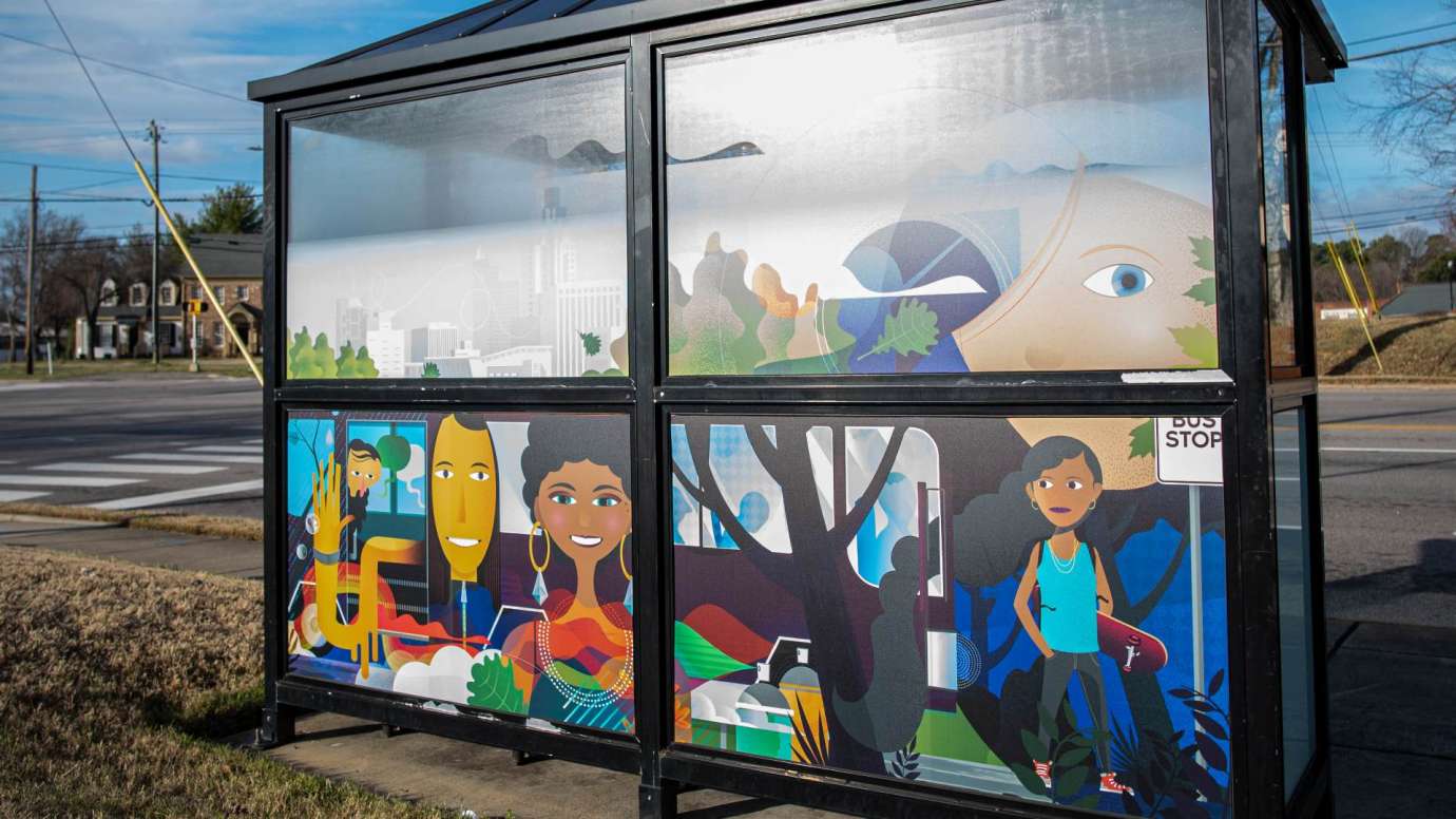Artwork wrapped on bus shelter windows titled The Next Stop by Tyler Jackson located at Wake Forest Rd and Old Wake Forest Rd
