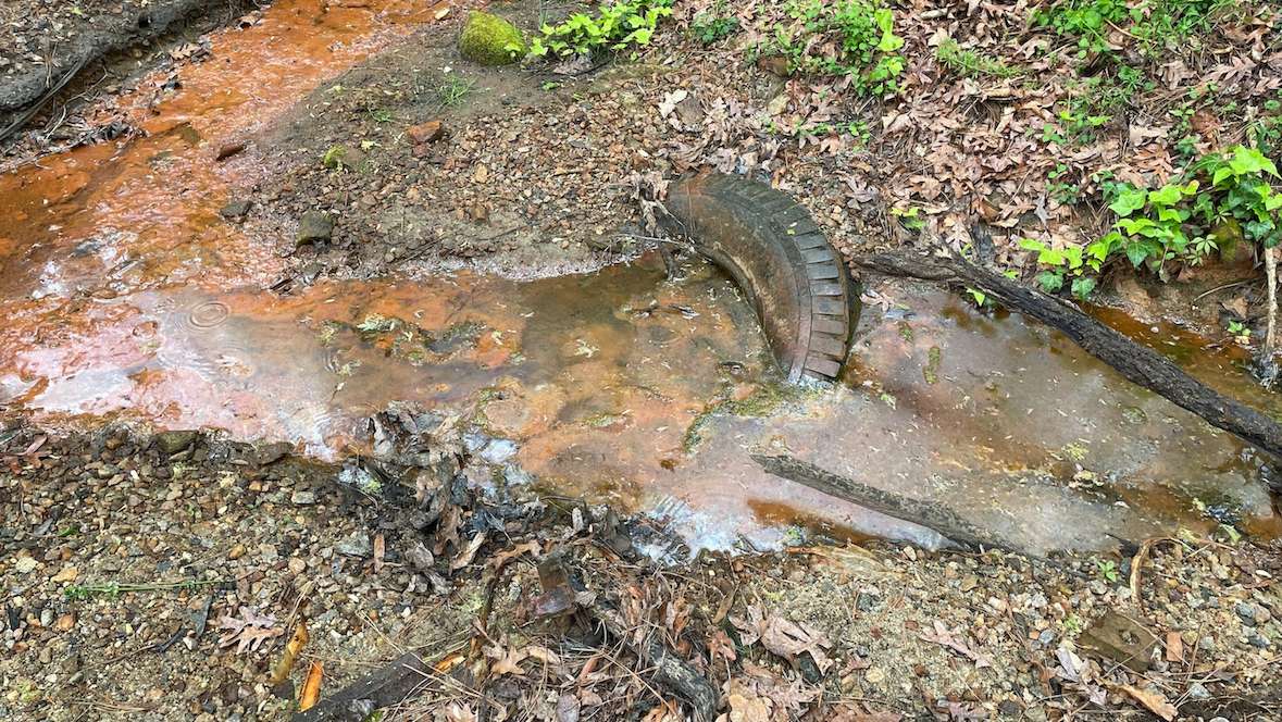 Vehicle tire in a stream.