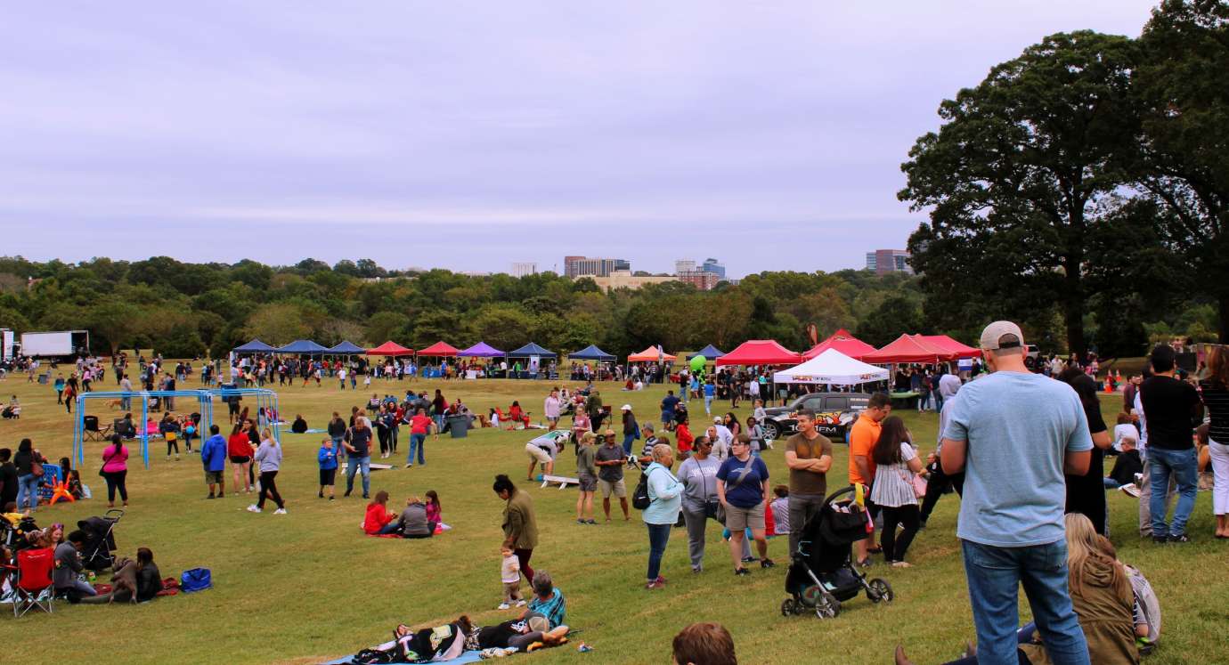 a cluster of people at Dix Park Field