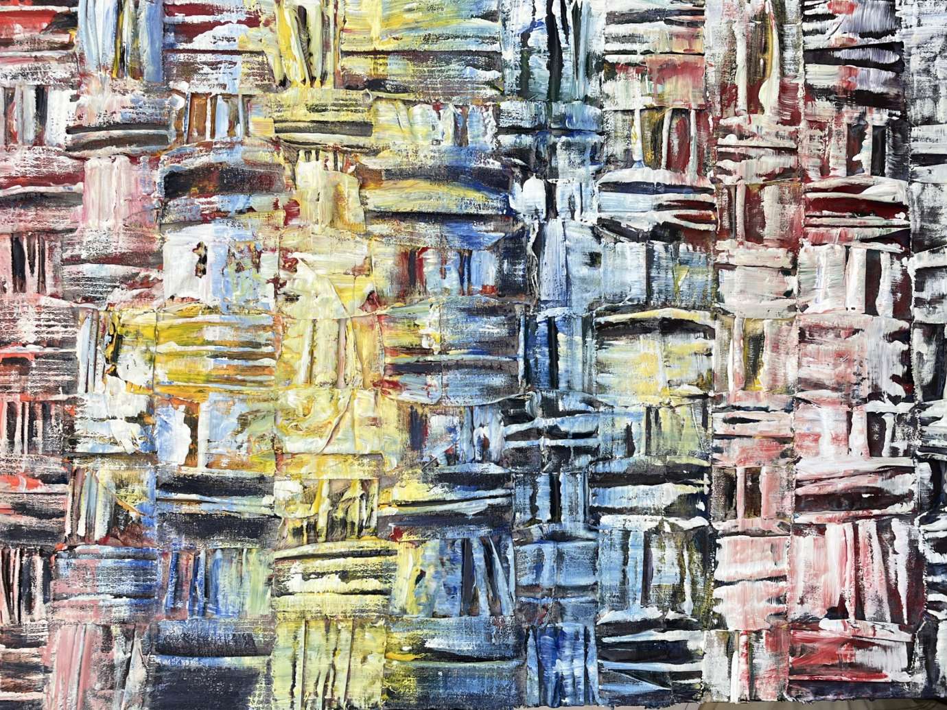 Artwork made with recycled textiles woven in a geometric pattern and painted. 