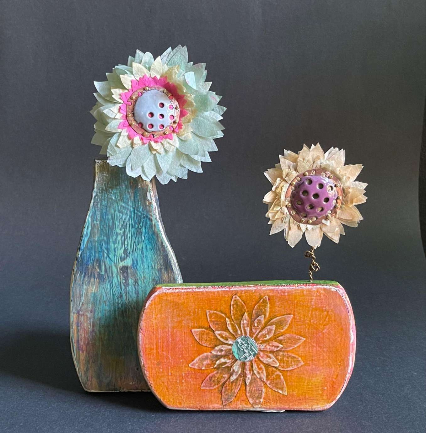 metal flowers in vases