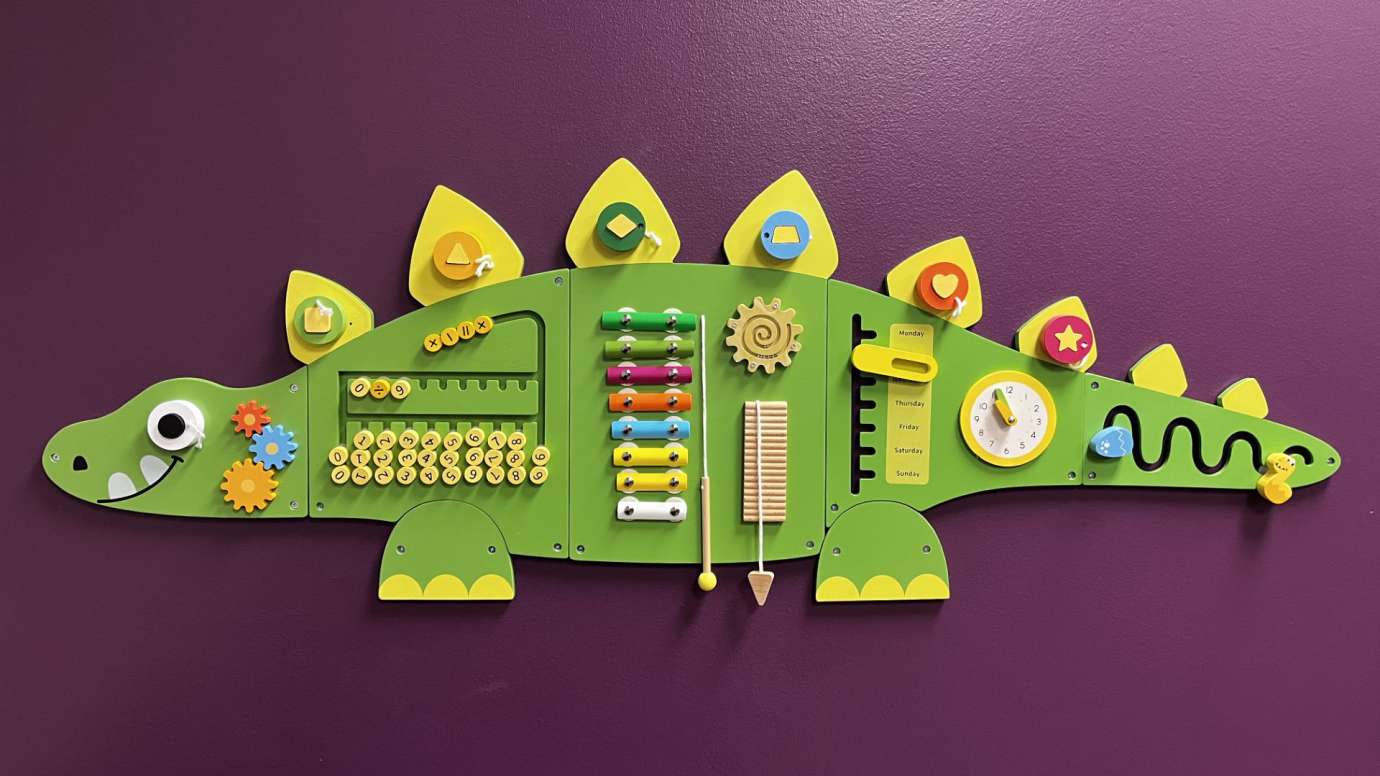 Sensory Friendly Feature at Green Road - Dinosaur Activity Wall