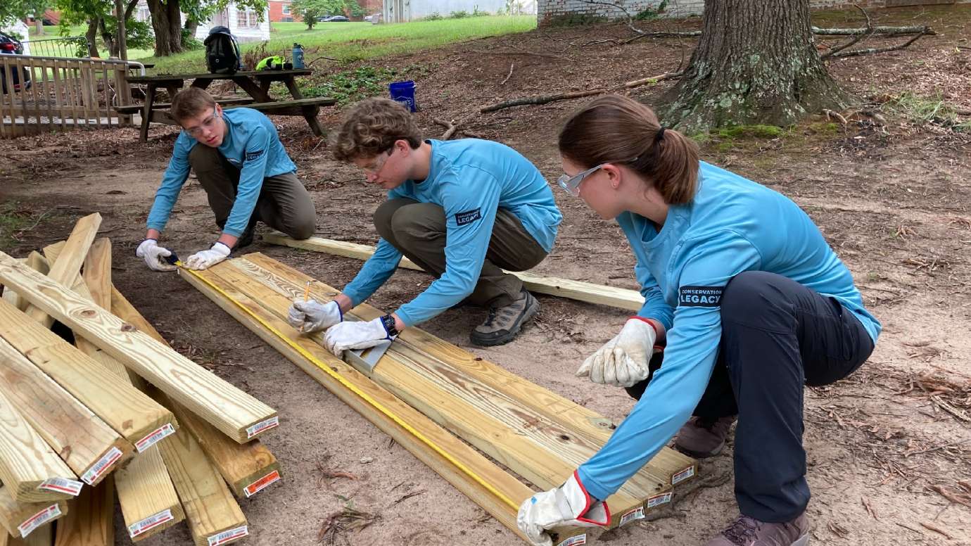 Teens building things with wood