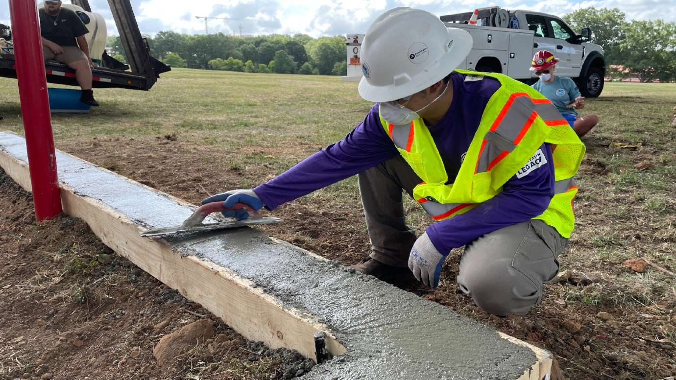 teen building a concrete curb