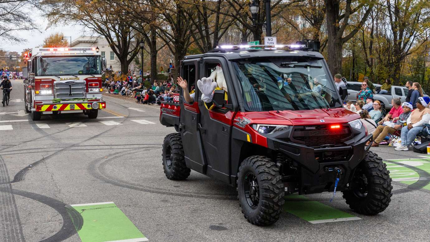 Fire truck and four-wheel vehicle at the Raleigh Christmas parade