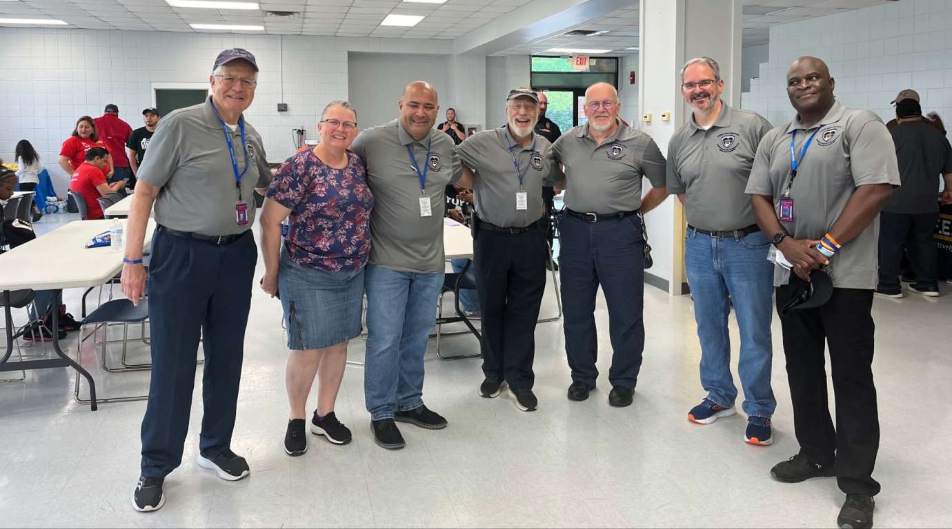 Group photo of people in lunch room