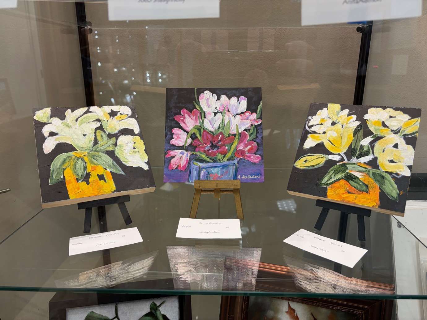 paintings in a variety of mediums on display 