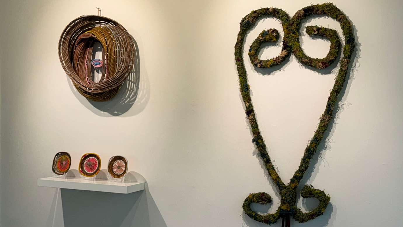 Basketry/Sculpture by Shakeeka Brooks displayed on the left with a heart shaped mixed media sculpture by Chris-Annia Dobson on the right