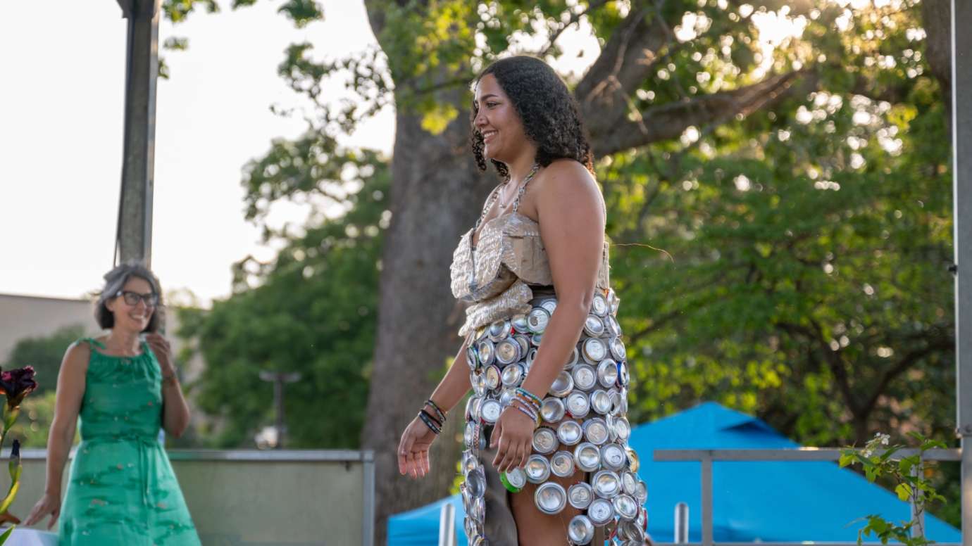 Woman in dress made of recyclable material