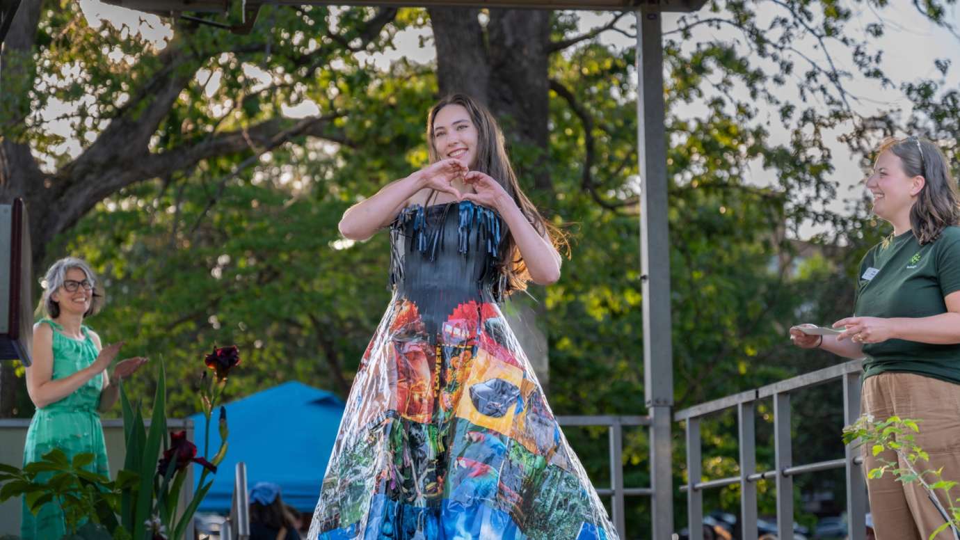 Woman wearing a skirt made of recycled magazines