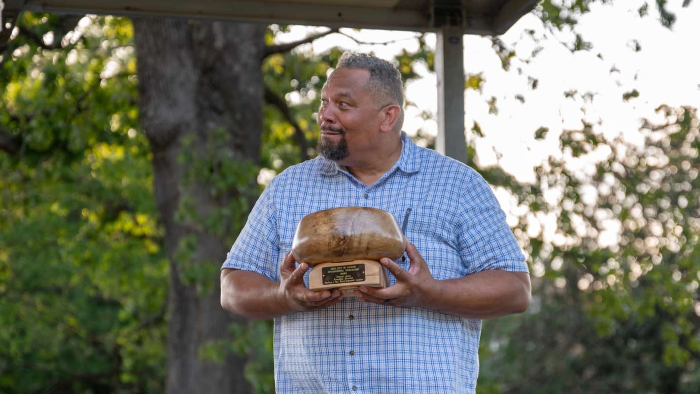 Man holding award