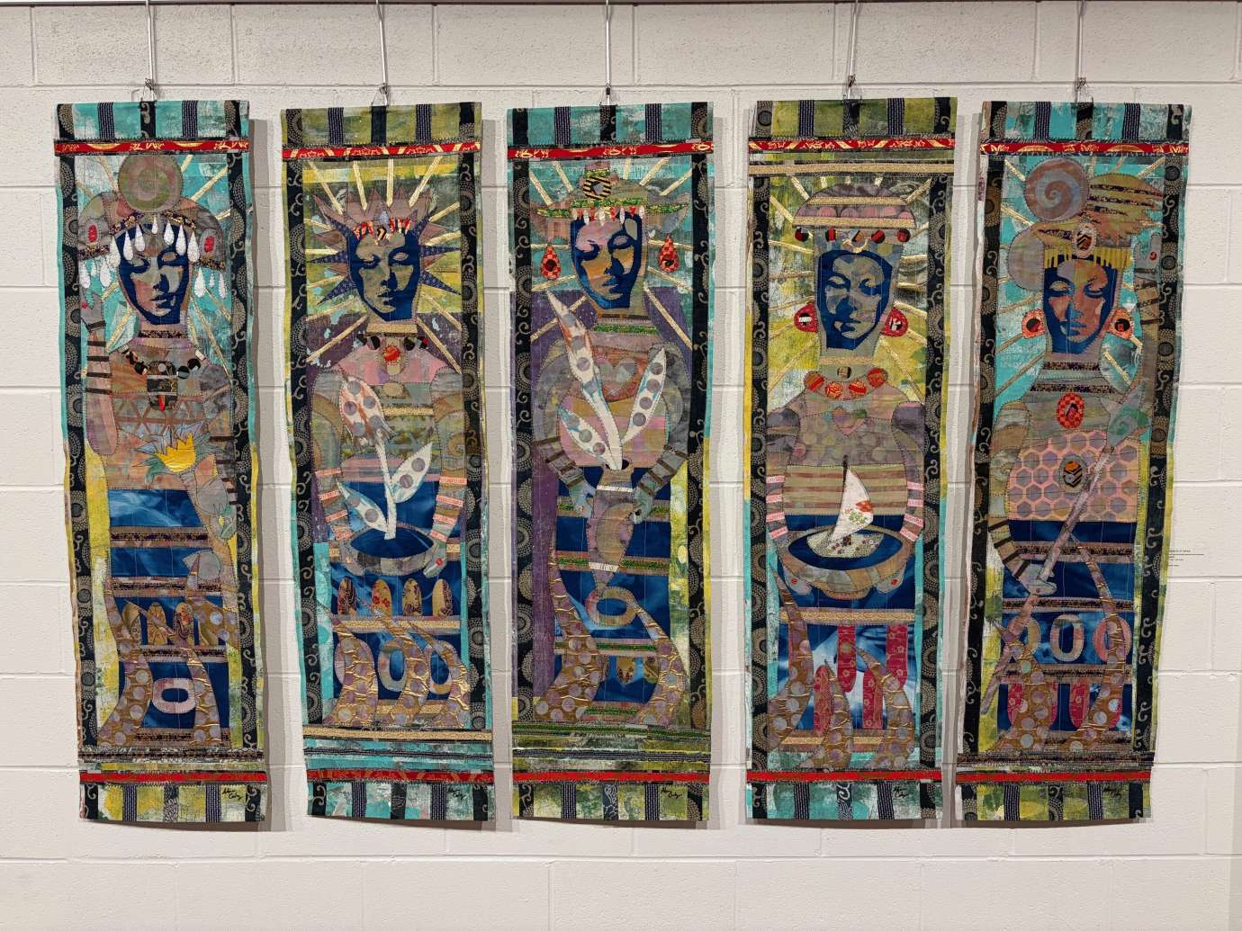 Works by Adam Cooley hanging on a wall 
