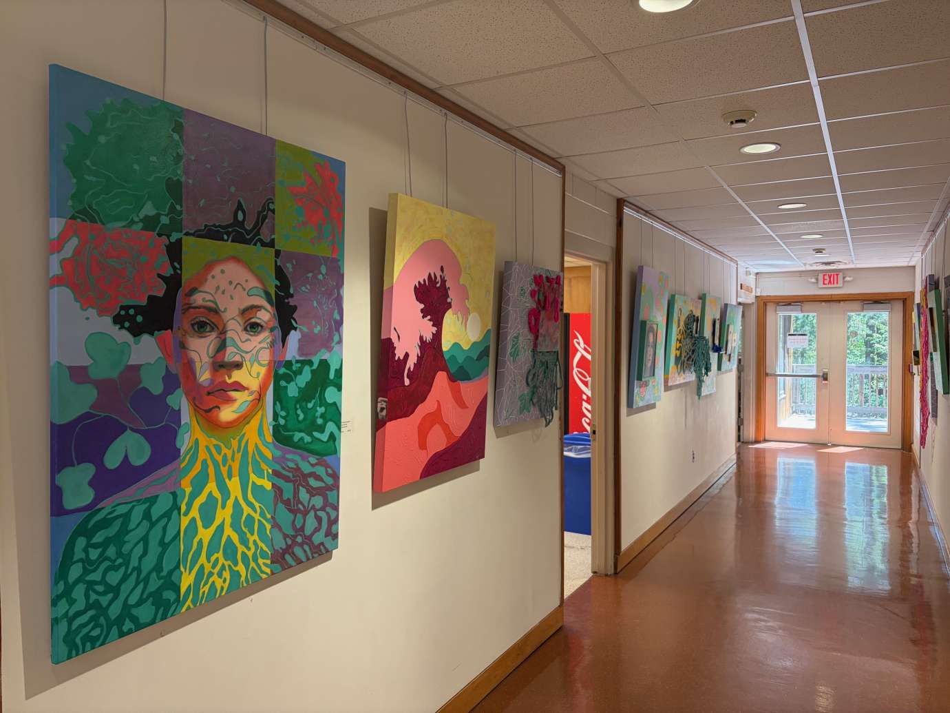 Paintings by Natacha Sochat hanging on a wall