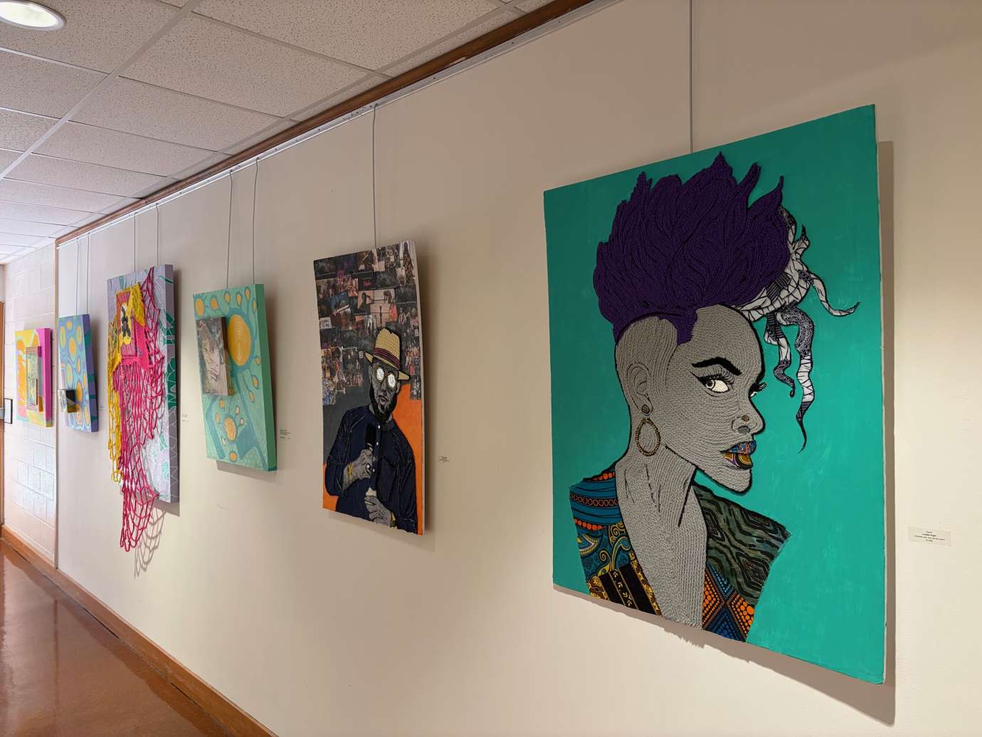 Works by Linette Knight and Natacha Sochat hanging on a wall 