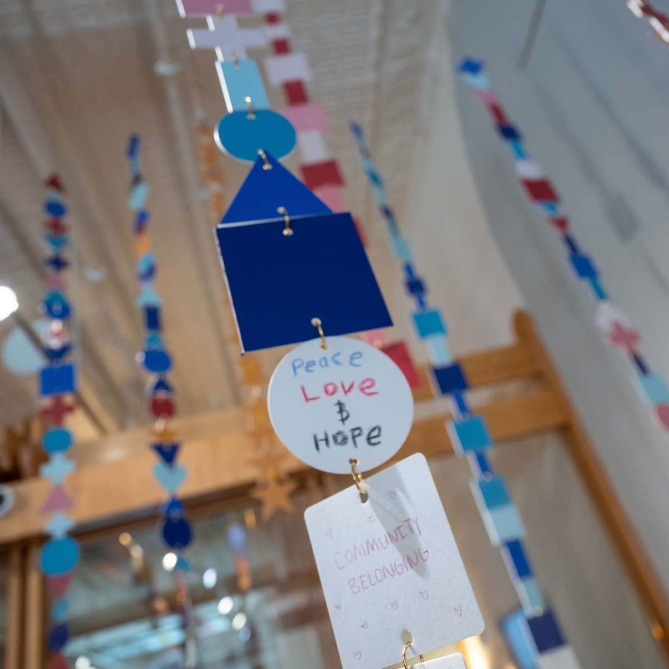 artwork hanging from the ceilings at the museum 