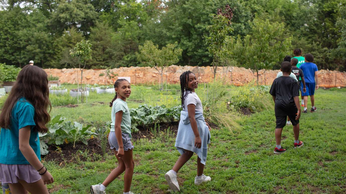 children walking through the garden at marsh creek