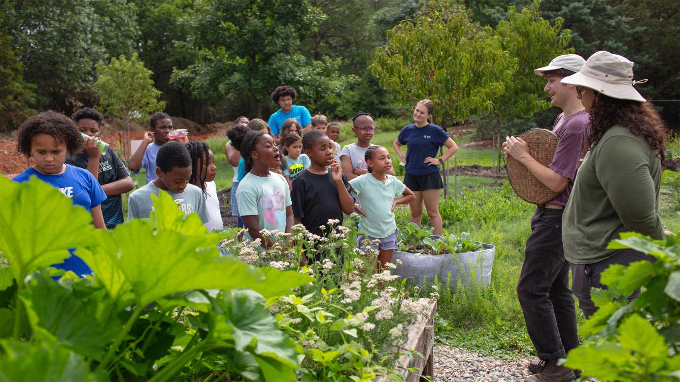 children enjoying the garden at marsh creek while listening to instructors