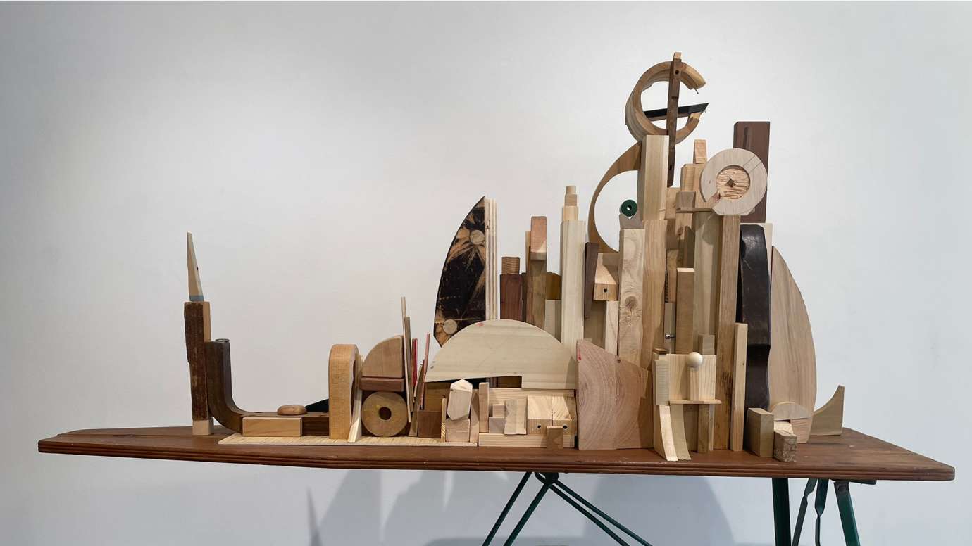 detail of mixed media work composed of wooden blocks and an ironing board by Jason Lord