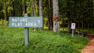 The trail and signage leading to the nature play area 