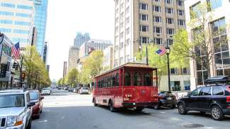 View of the historic Raleigh Trolley driving around downtown Raleigh