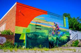 Mural of a person on a bike.