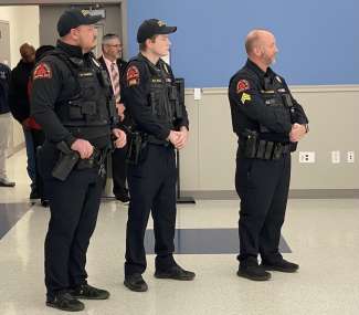 Three members of the RPD DWI Unit stand at the news conference announcing the new unit and the Booze It and Lose It campaign.