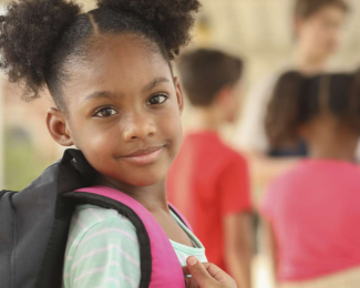 Child holding bookbag